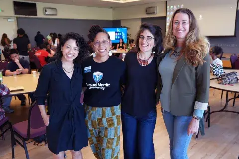Four members of the Community Reads Team in classroom.