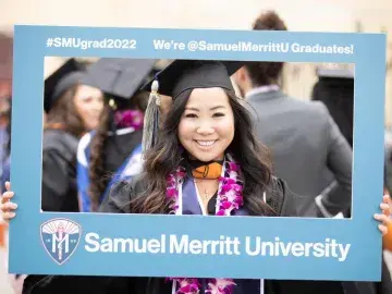 Smiling SMU graduate on Commencement Day