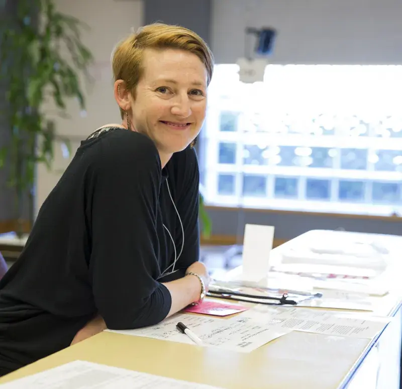 Faculty member at poverty simulation event